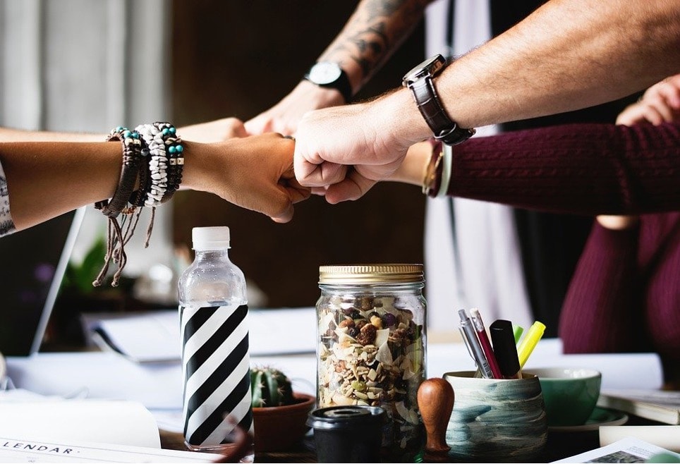 To hand-shake, fist-bump or smile: how to greet your colleagues in the new norm