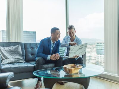 onboarding new employees two men looking at a laptop