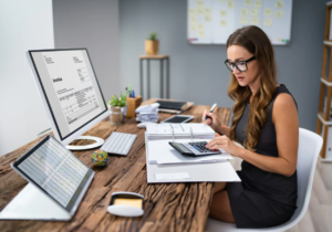 Accountancy skills that will elevate you to greatness, woman with computer