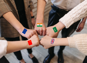 hands with international flag stickers
