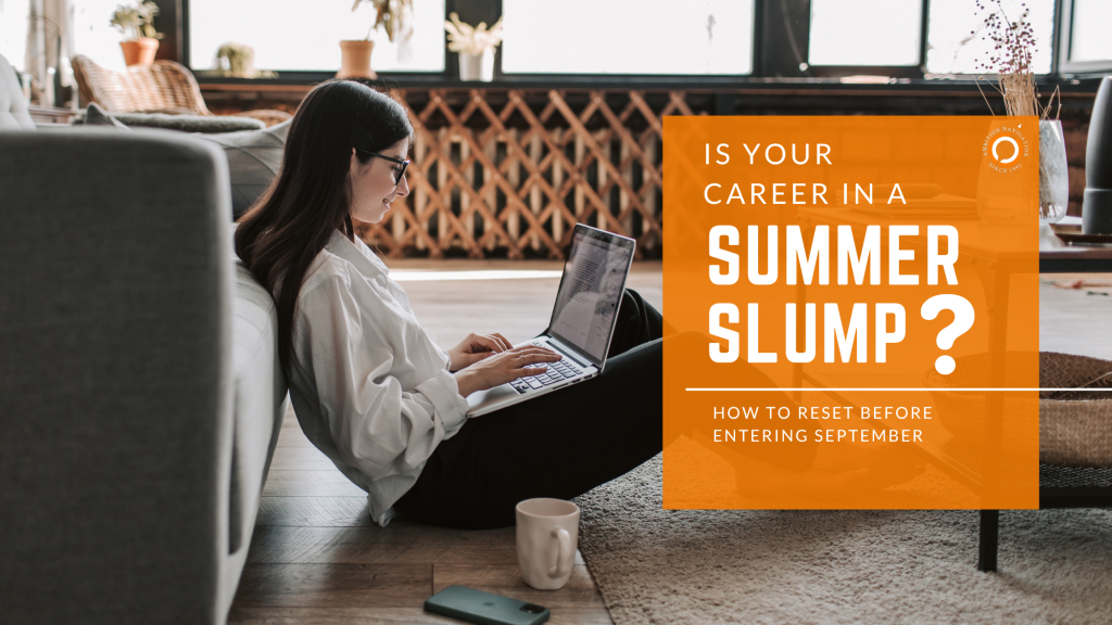 A person sitting on the floor using a computer trying to sort out career plan during summer slump